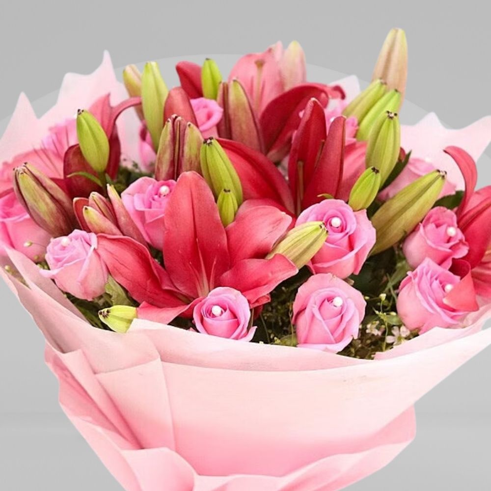 pink rose and lilies with pink paper 